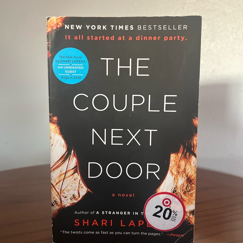 's 'The Couple Next Door' - Black and Red Cover